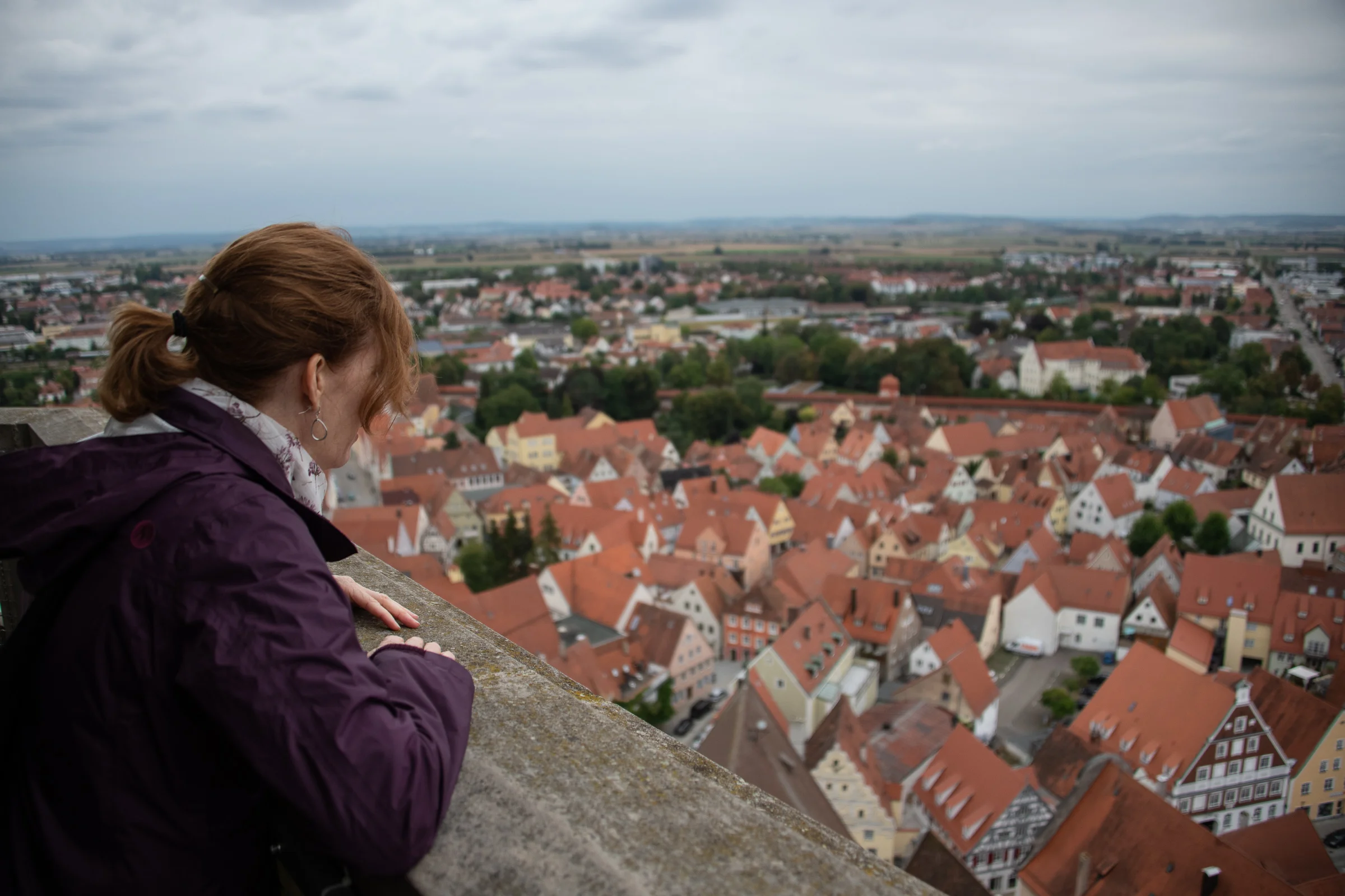 Melissa peering over the steeple ledge