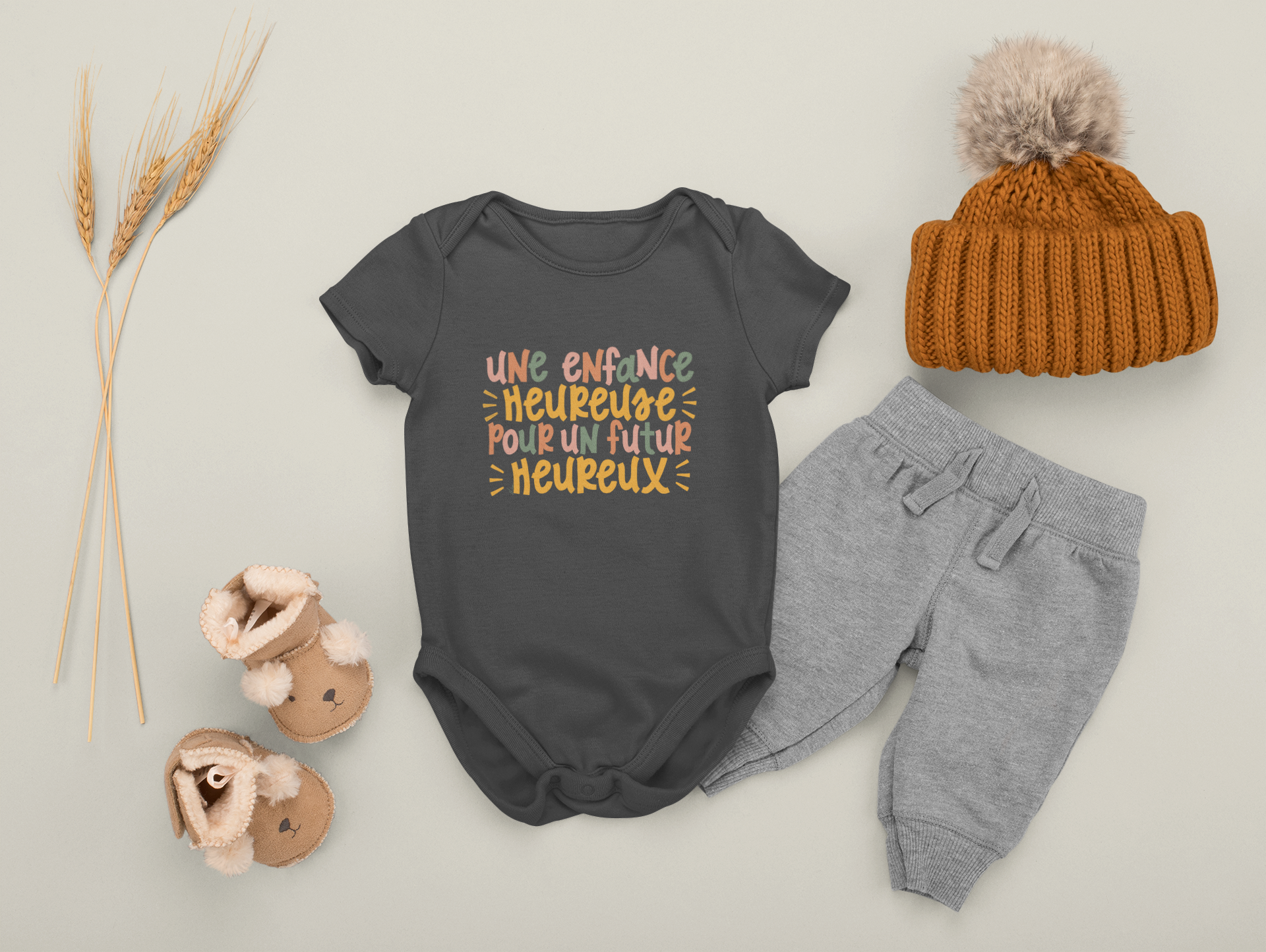 onesie-mockup-featuring-a-baby-boy-s-outfit-placed-on-a-plain-background-m1134.png