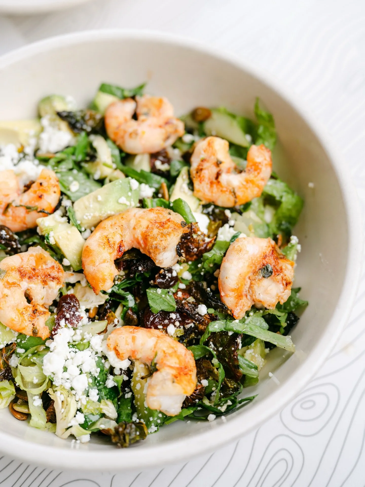 Proof that New Year&rsquo;s resolution can still be delicious! Crispy &amp; shaved brussels sprouts, baby romaine, dried cherries, spicy pumpkin seeds, avocado, goat cheese, apples, all tossed in apple cider vinaigrette made with avocado oil🥑🍤