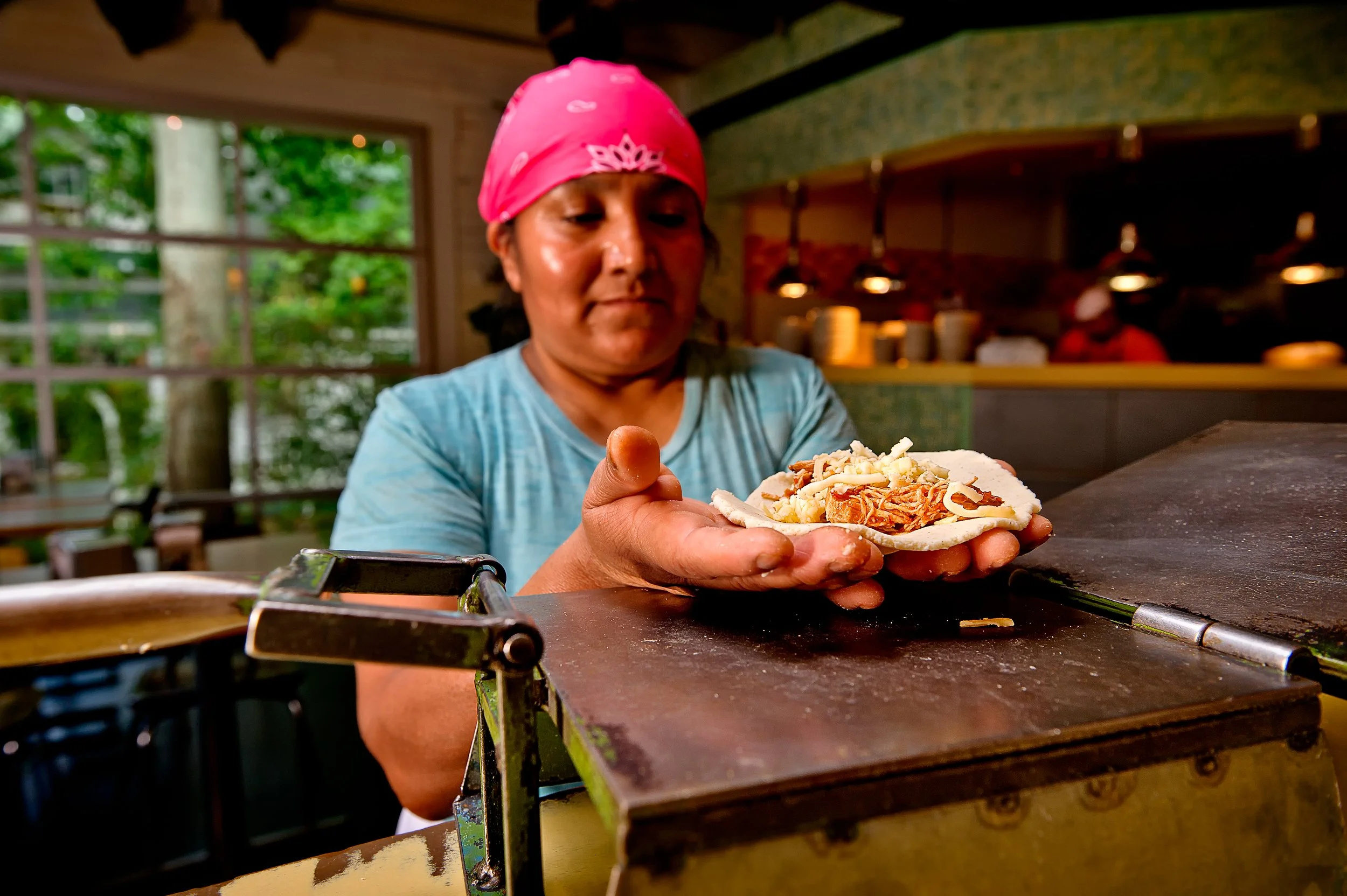 Maria open quesadilla in hand .jpeg