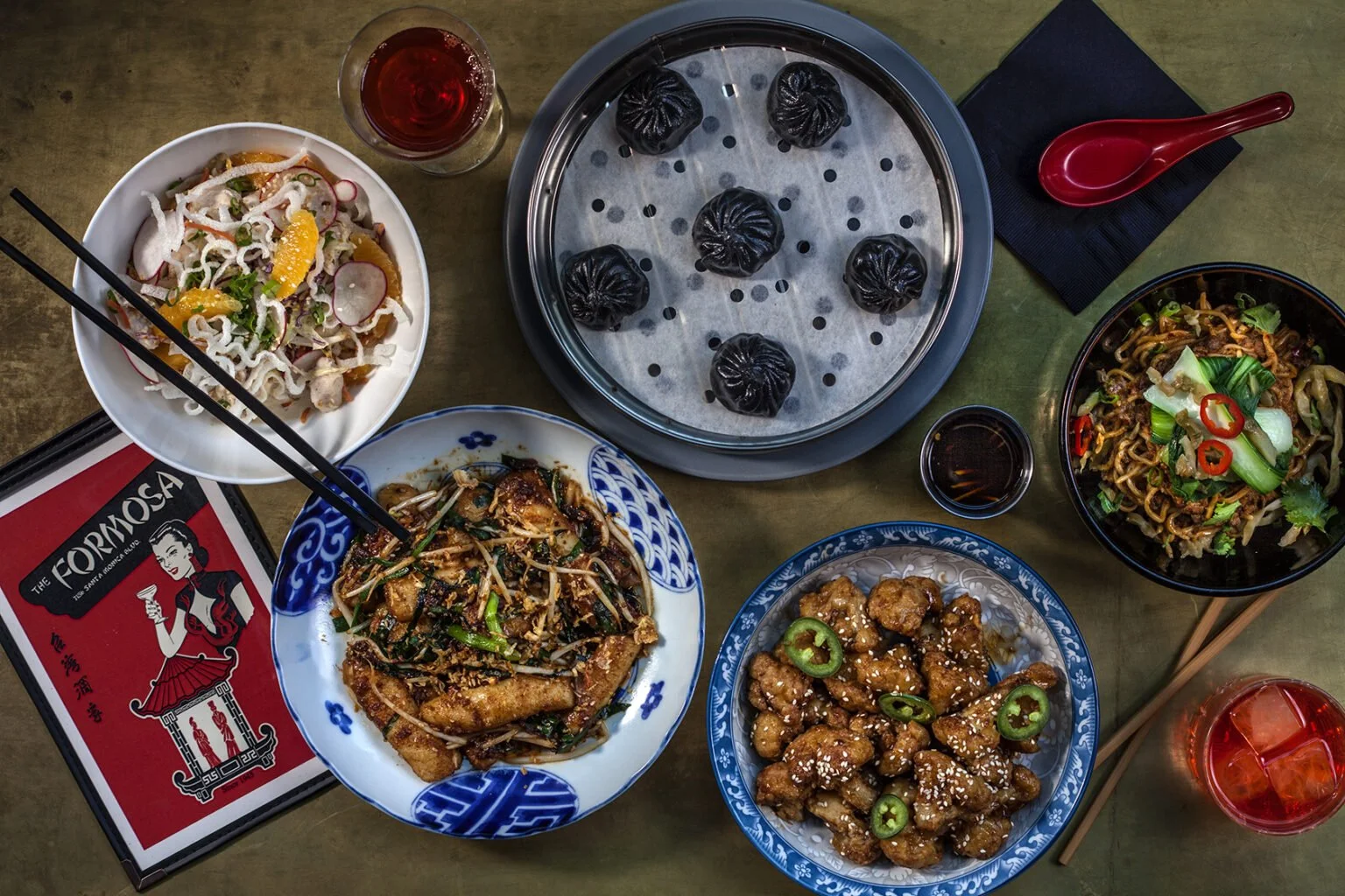 A variety of Chinese-American lunch dishes at The Formosa Cafe, including dim sum, noodles, and specialty cocktails.