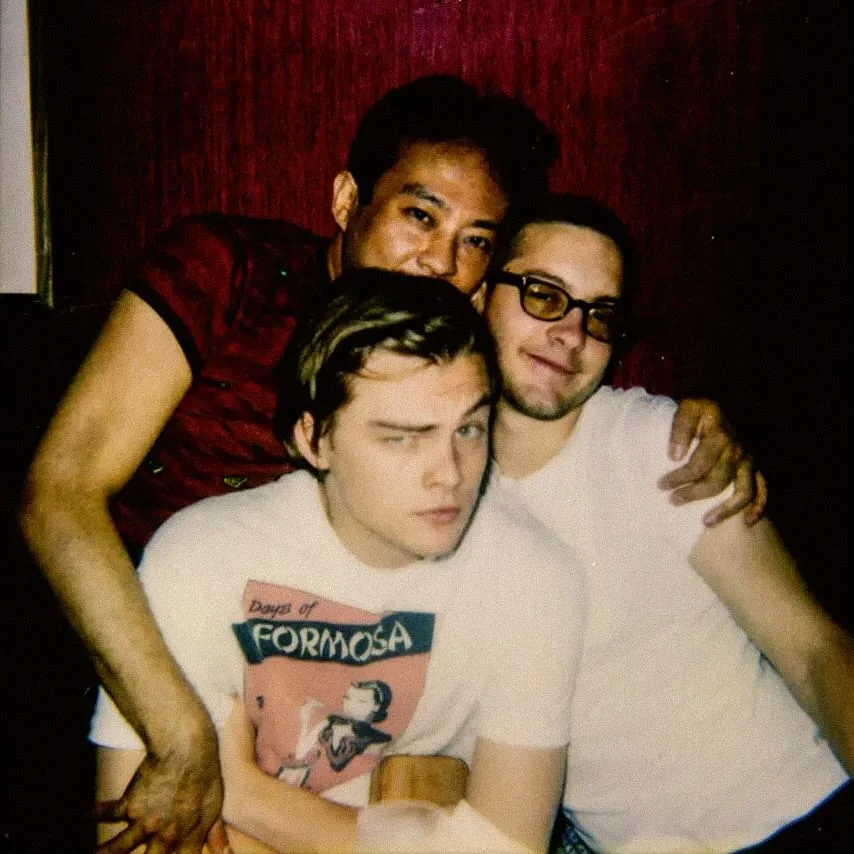 Vintage photo of Leonardo DiCaprio and Tobey Maguire seated together inside The Formosa Cafe.