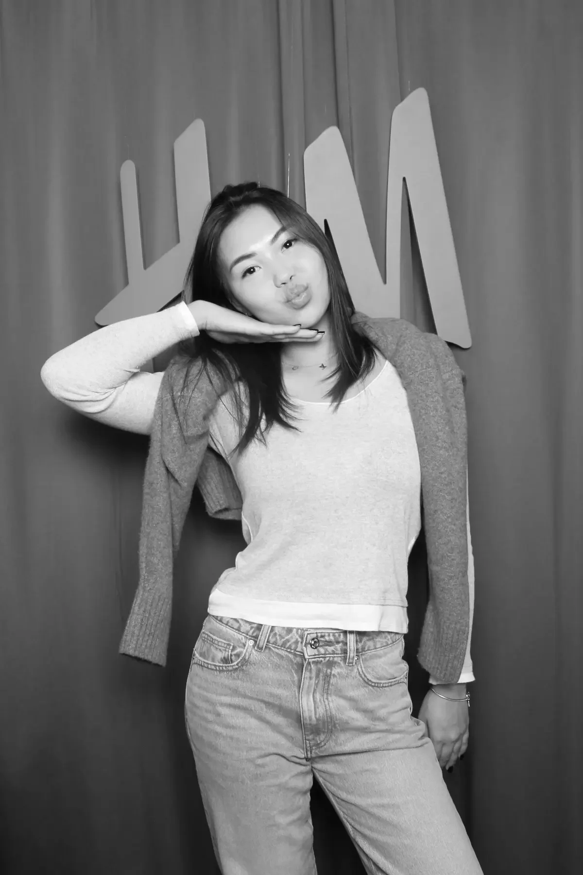 Fancy Booths black and white glam photo booth for an H&M brand activation in Bellevue Square mall grand opening, featuring high-contrast studio lighting and custom logo backdrop.