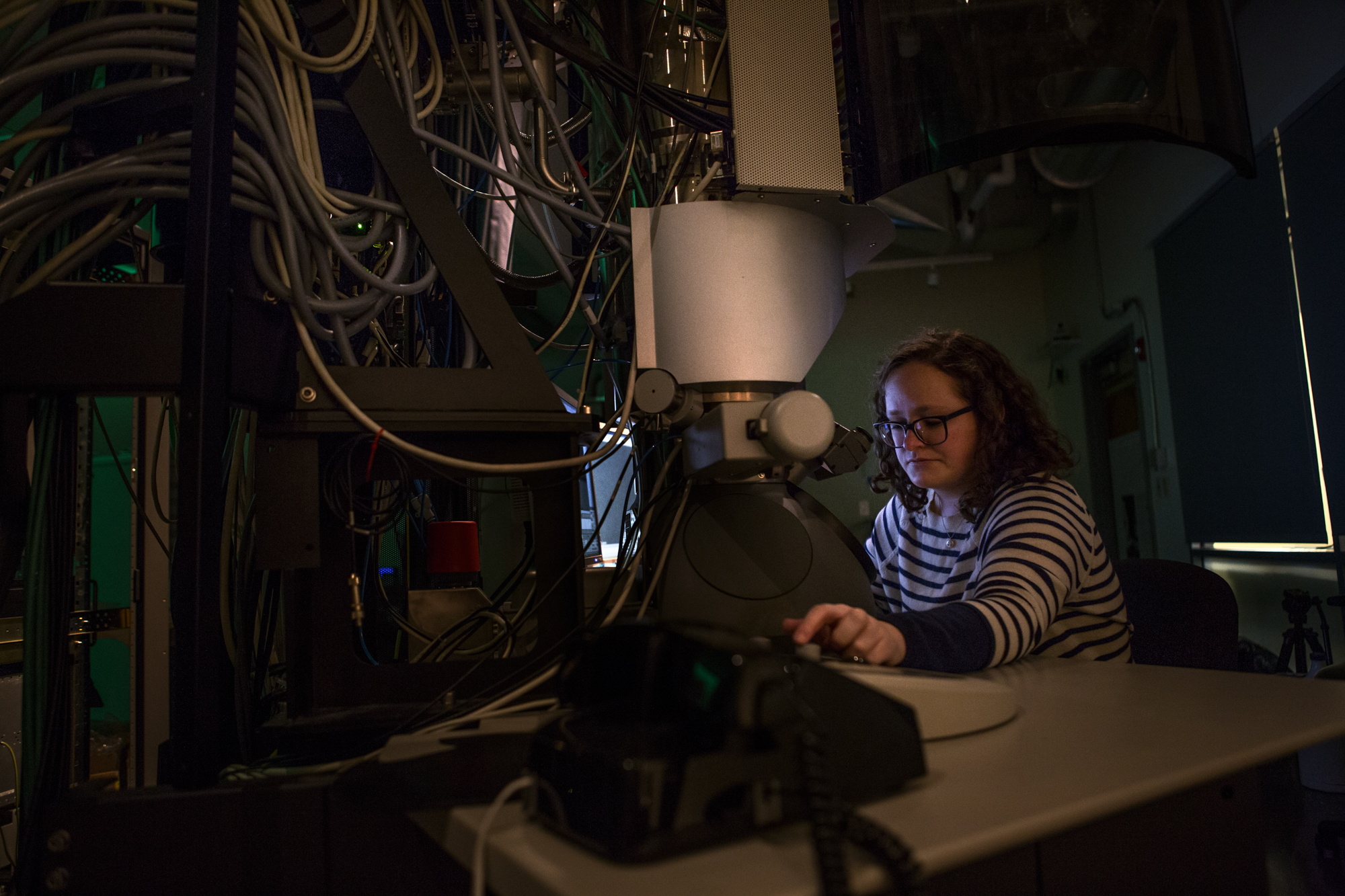  Alice Greenberg, physics Ph.D. candidate at the University of Oregon spends a Saturday afternoon in the dark basement of Huestis Hall in the CAMCOR lab studying electrons. Greenberg co-founded UO Women in Physics. 