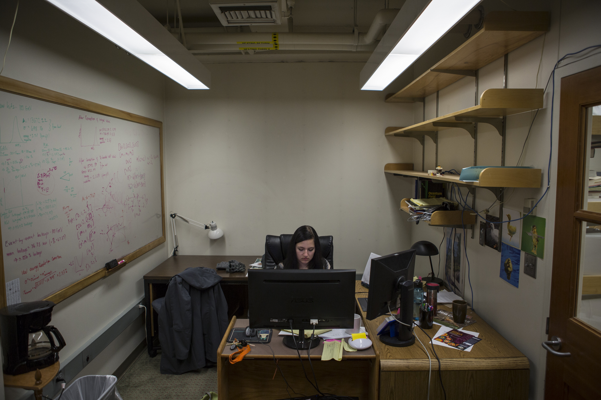  A mere month before heading to Switzerland to help design high energy experiments at CERN's Large Hadron Collider (LHC), Amanda Steinhebel analyzes data in her modest office at the University of Oregon.  