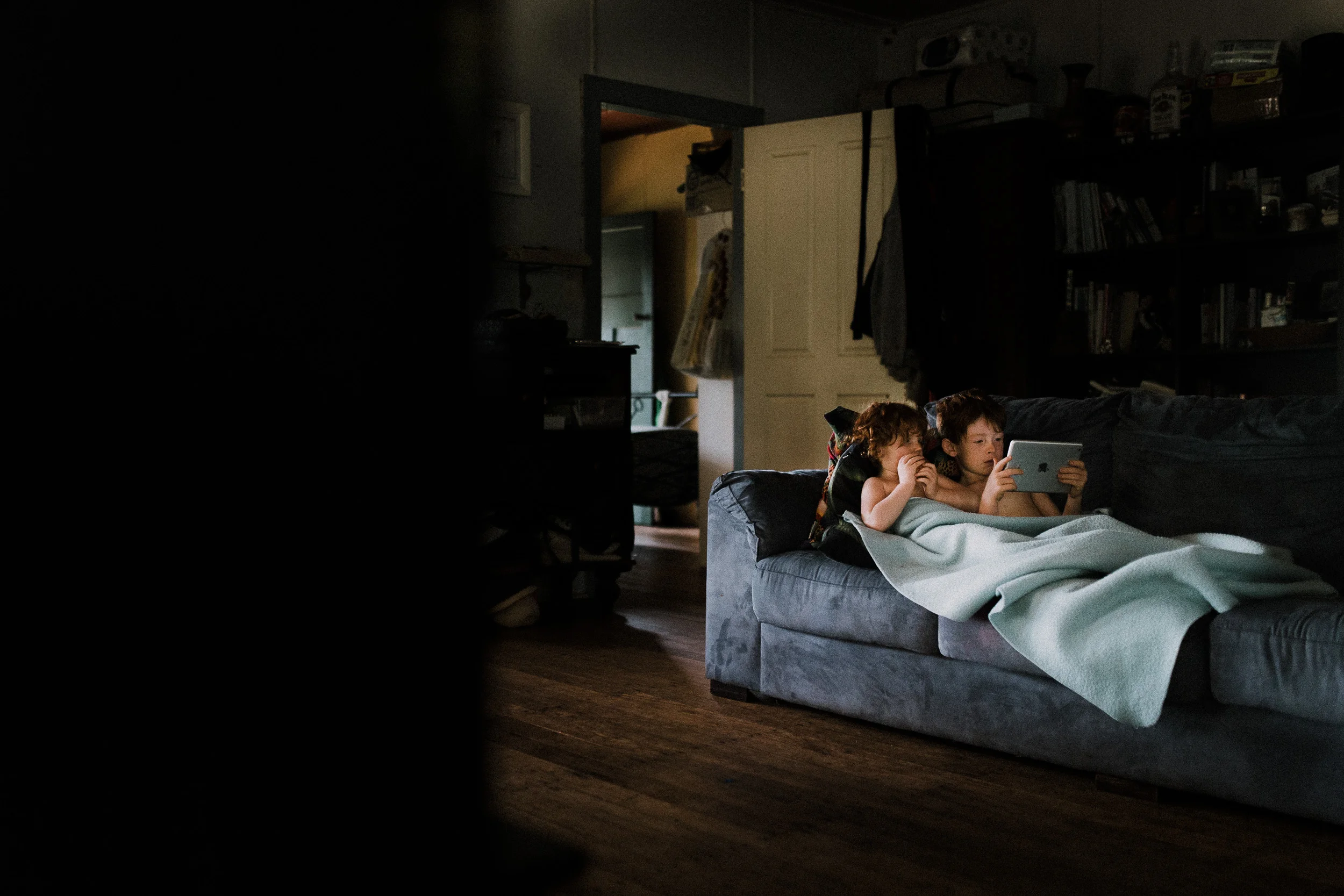 Robert and Ellie watching iPad on a rainy day