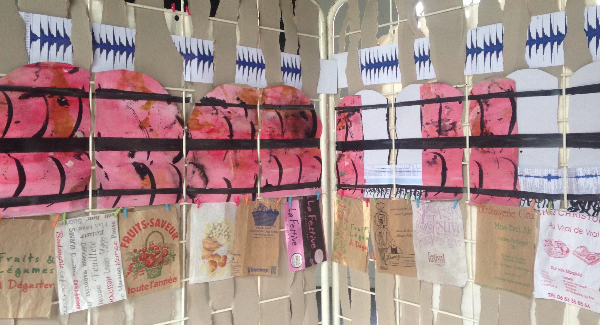 Detail of my window pages, complete with paper bag prayer flags and shutters, open & closed.