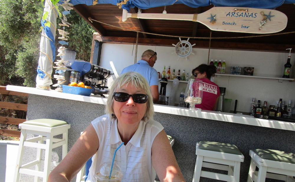 In a café somewhere near a beach (anywhere)