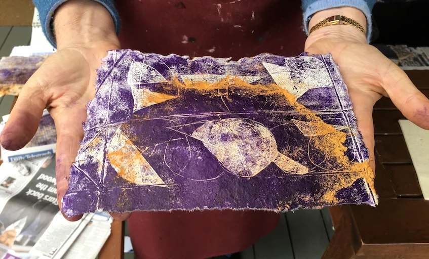 The purple ink on the rusted orange paper looked great.