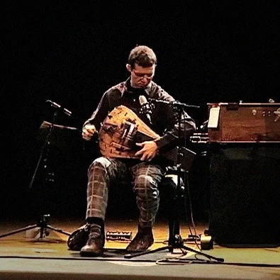 Matthias Loibner making sounds with plaid pants and astounding virtuosity.