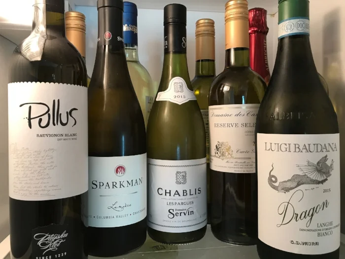 Sure, keep a variety of white wines in your refrigerator. Just plan ahead for when to take a particular bottle out.