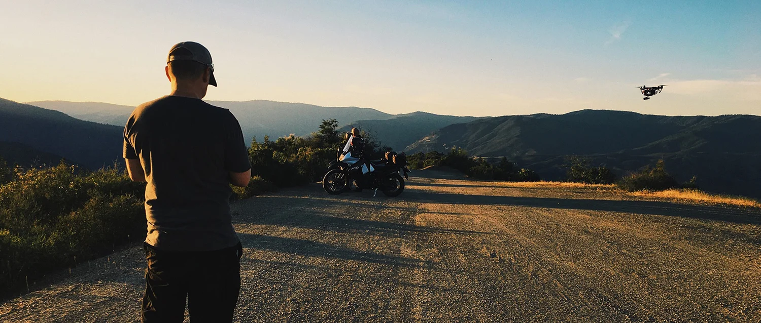 Drone capturing the final shot of the film as the sun sets over the mountains