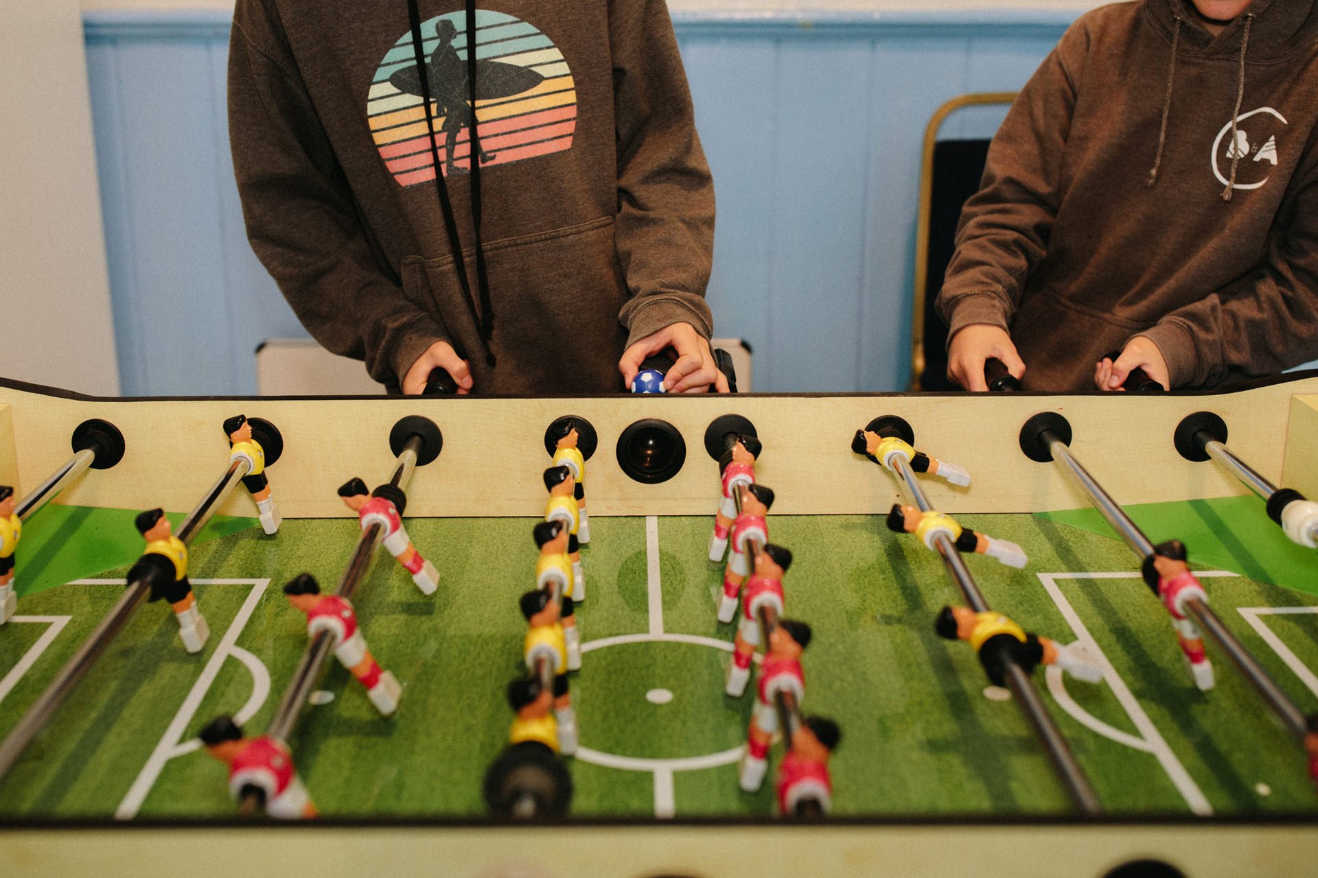 brown hoodie table football.jpg