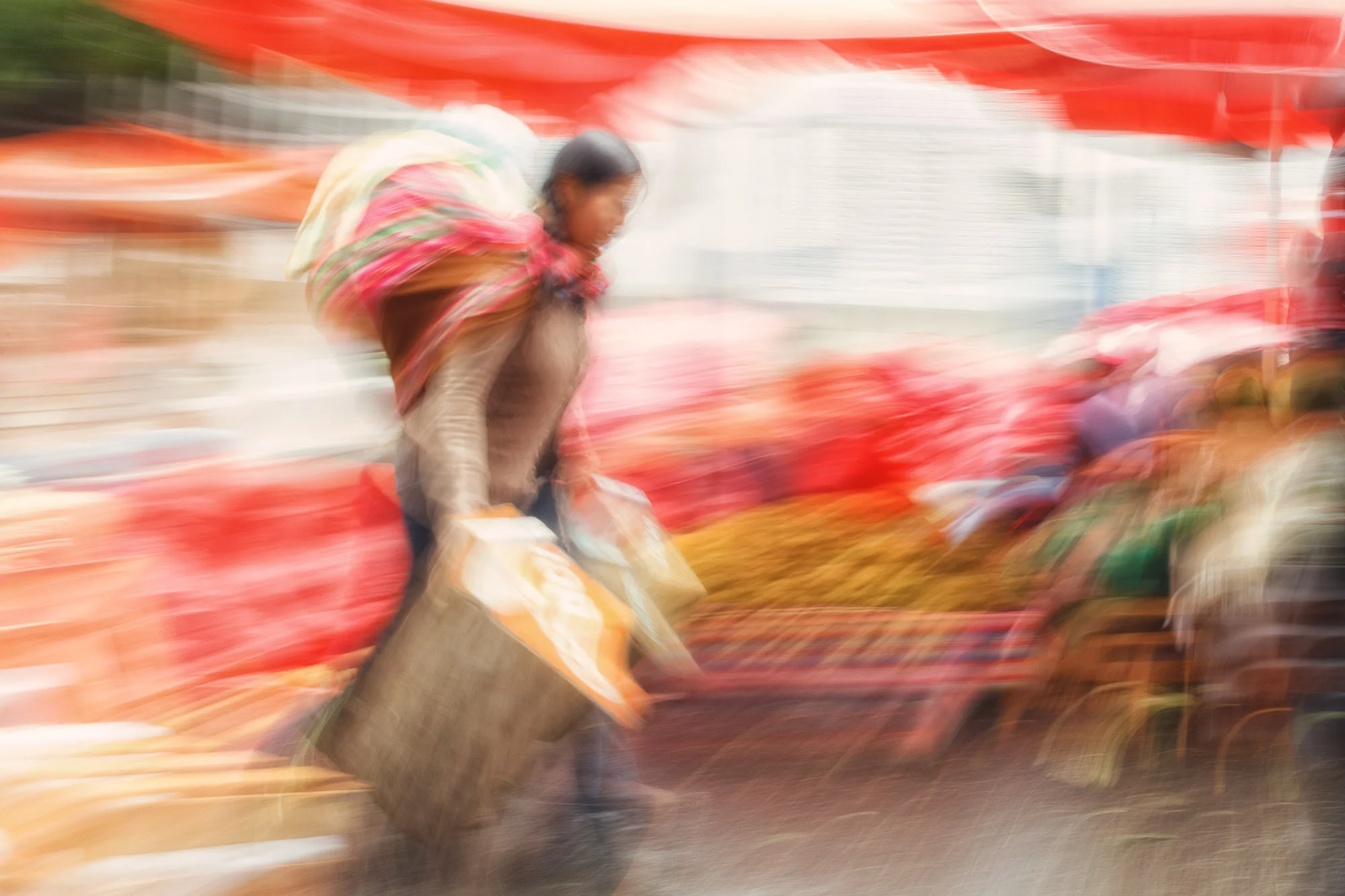 La Paz market. Bolivian woman carrying two basket. Bolivia