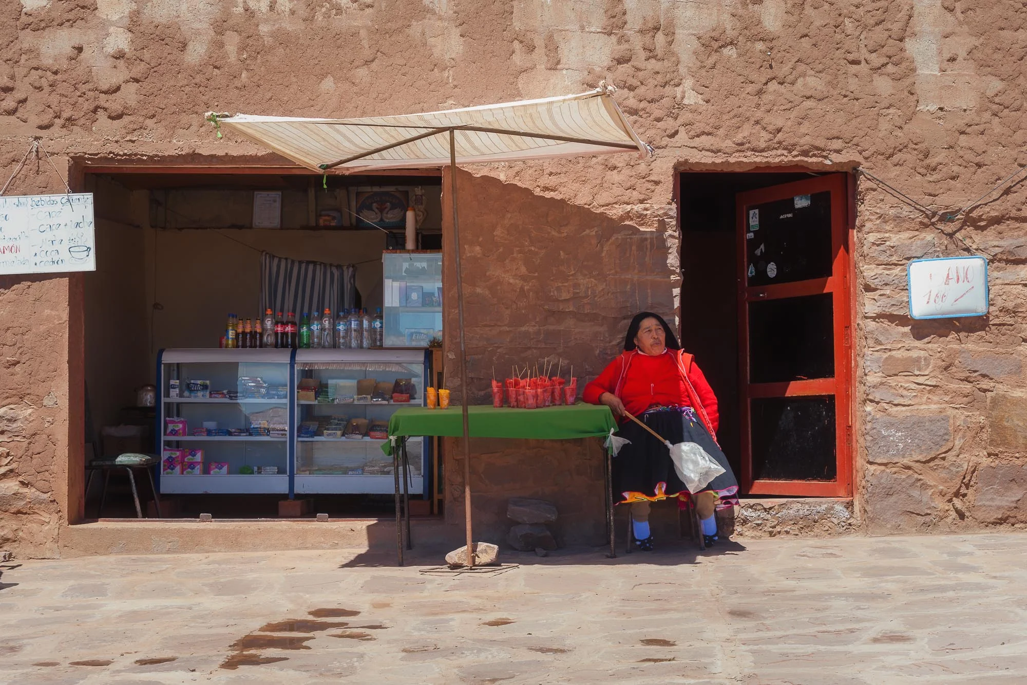 Water melon.The owner of the central bar of Taquile waiting for the first customers. Taquile, Peru