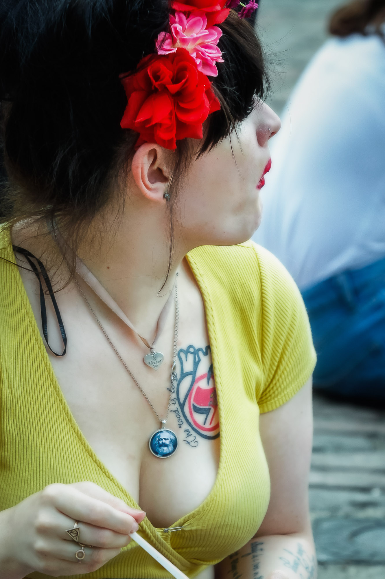 Marx. A woman is seen taking a break during a rally in Trafalgar Sq. London