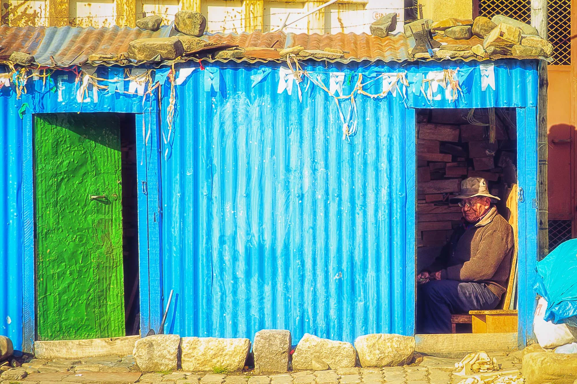 Descanso. A Bolivian man enjoying the sun at dusk. La Paz, Bolivia