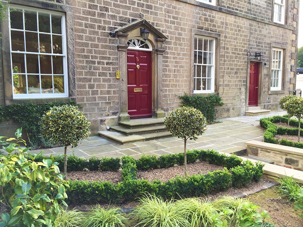 Formal front garden and rambling back cottage garden