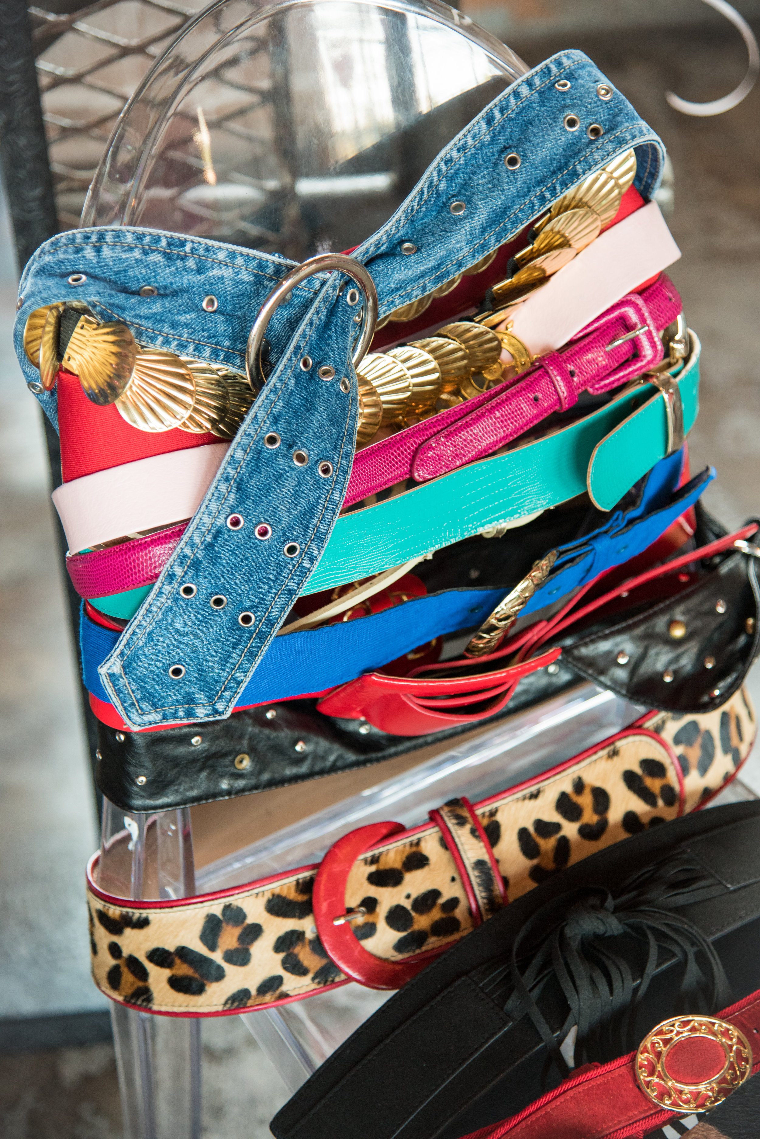 I love using a chair to organize my belts at pop-up markets!