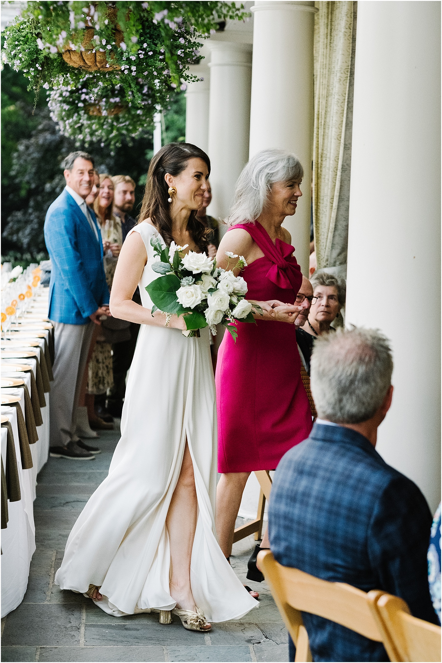 Bride walks down the isle with mother at Saddle and Cycle Club Chicago wedding by Michael and Kristin