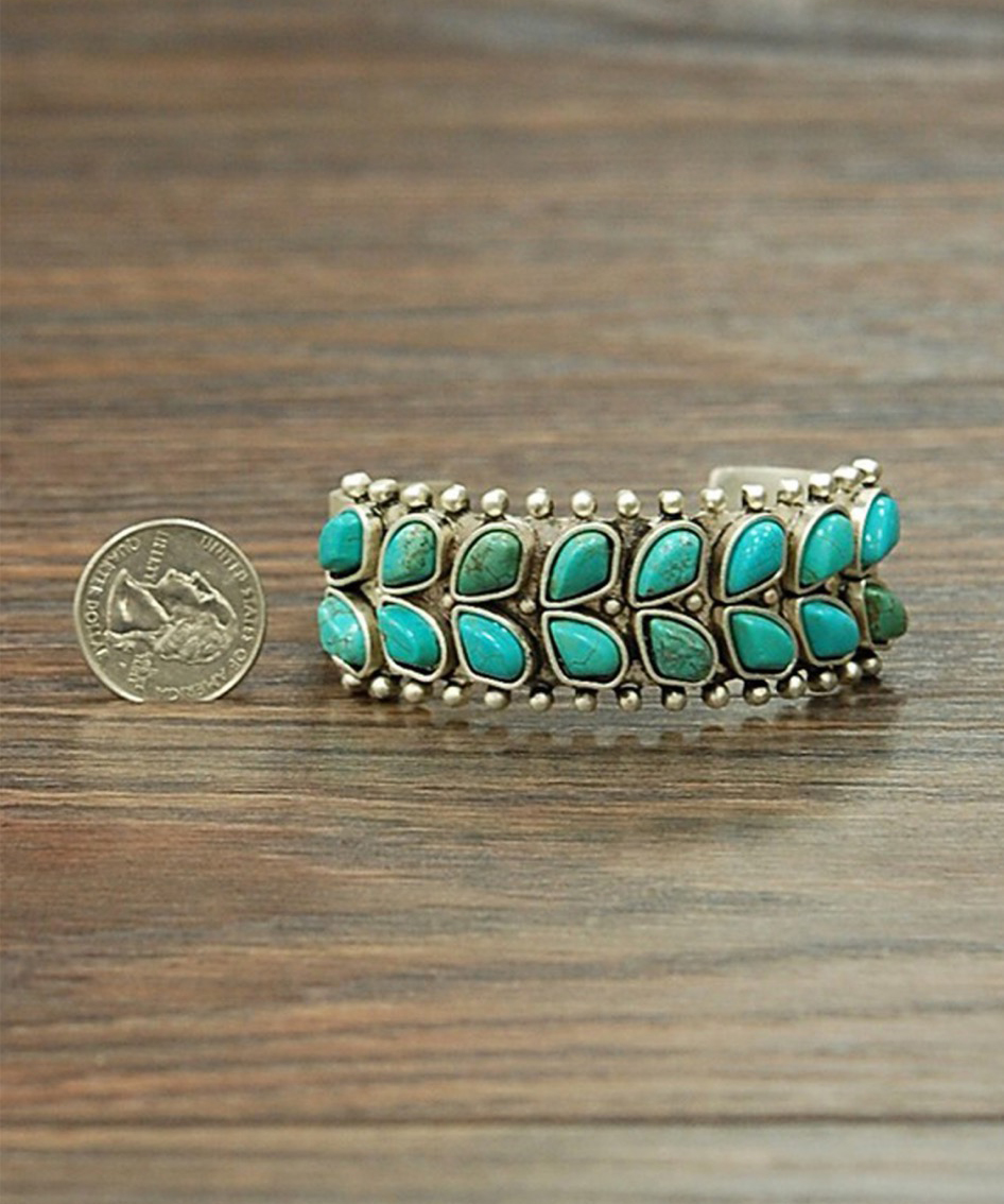 The Paiute Cuff from Wild Rag Boutique for scale next to a standard us quarter #wildragboutique #bohowestern #western #cowgirlstyle #cowgirl #fashion #style