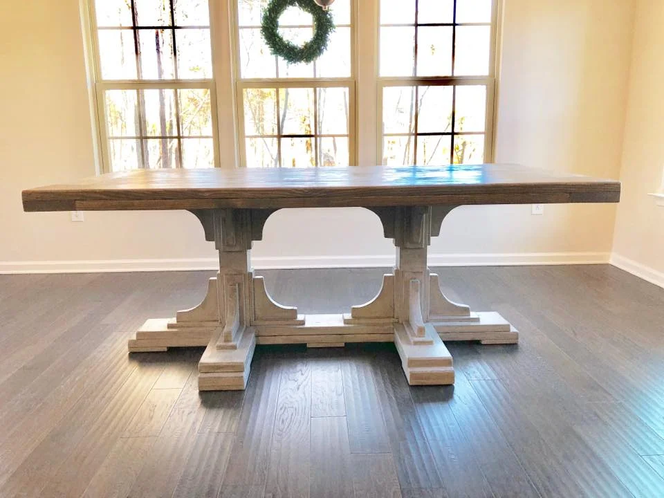 Statement-making table perfect for a large open space. $400 per linear foot Needs to be a minimum of 6' for this base. $400 per foot (6' table is $2400) .