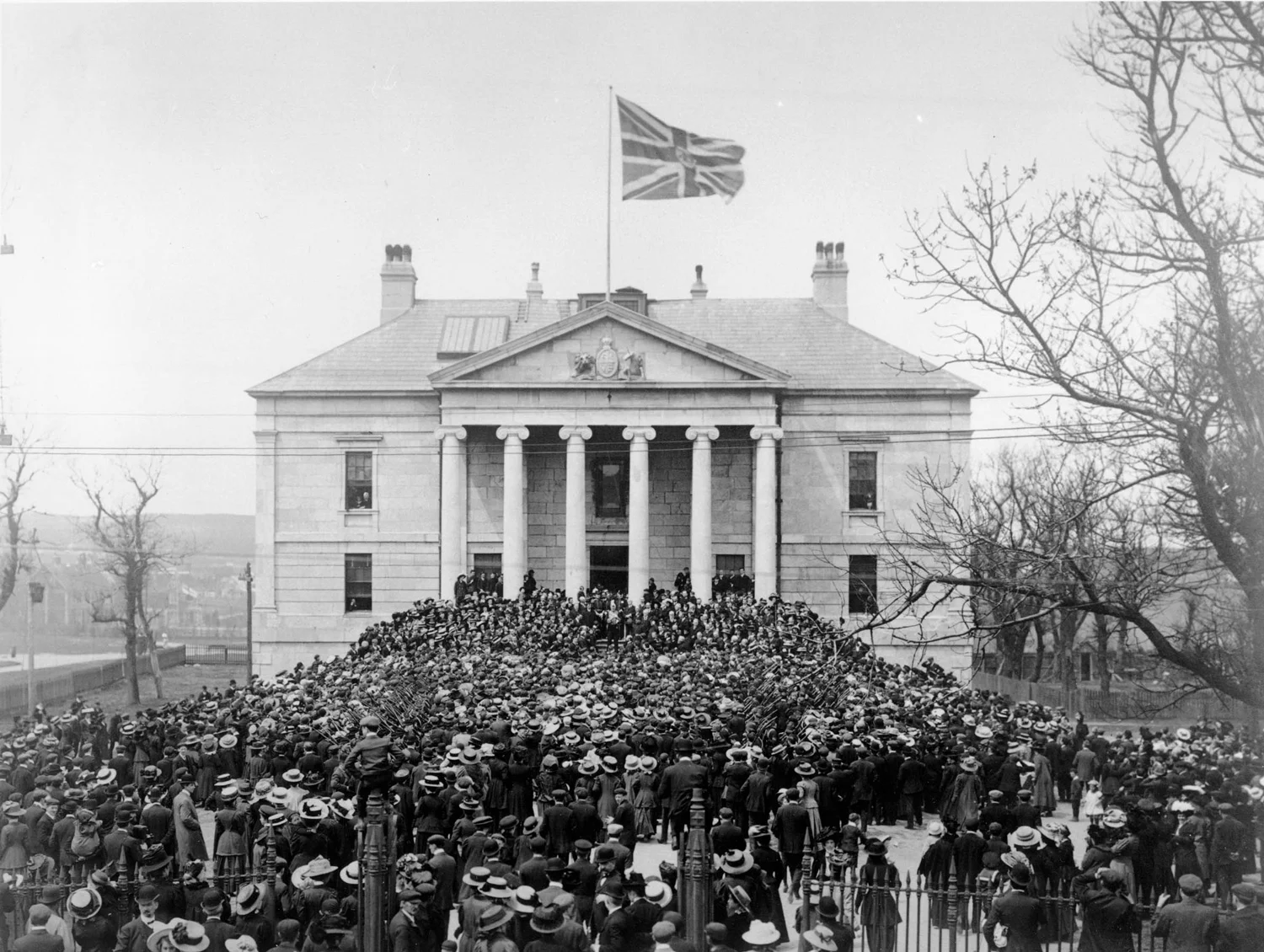 HISTORY HAPPENED HERE The Colonial Building during the riot of 1932.