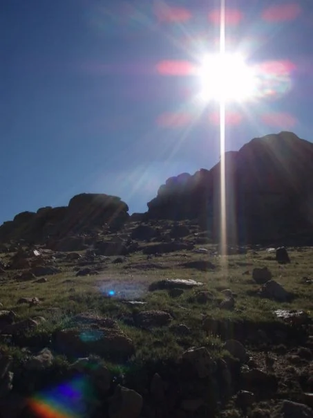 As we cross over the first big crest, so does the sun.
