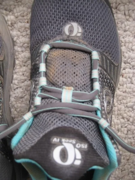 Then, cross the laces again until you've used up all but the top two holes or loops.