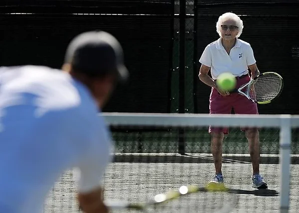 100-year-old Louise Donner at the Pinehurst Country Club, where she plays tennis with pro Marshall Carpenter twice a week on the clay court. Photo by Cyrus McCrimmon, The Denver Post.