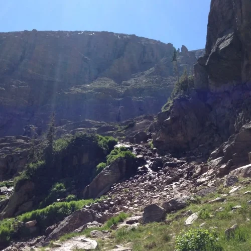 Steep scramble alongside a waterfall to reach Lake of Glass.