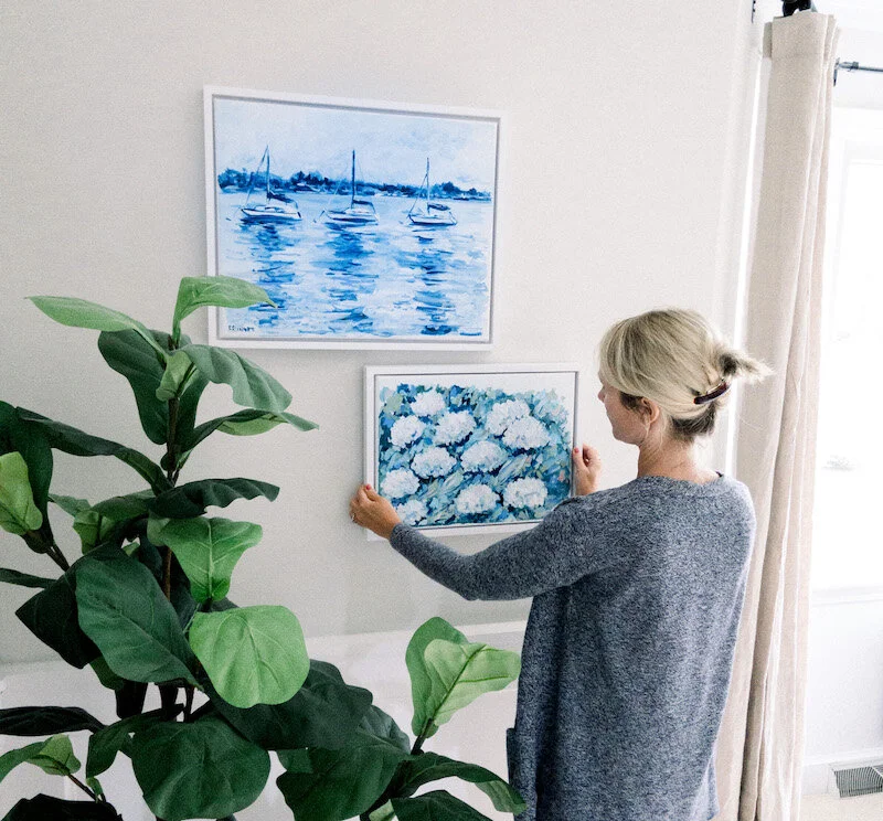 Some of my blue and white framed coastal inspired paintings in my home.