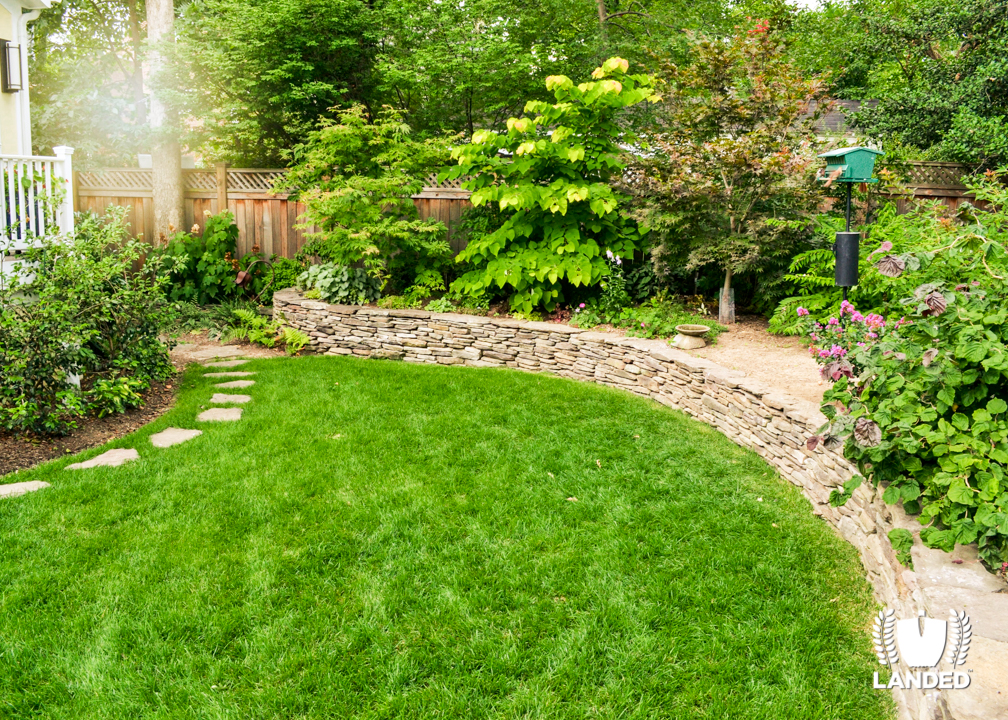 Lush, Green Backyard with Custom Designed Landscaping and Flagstone Stepping Stone Path | Landed 