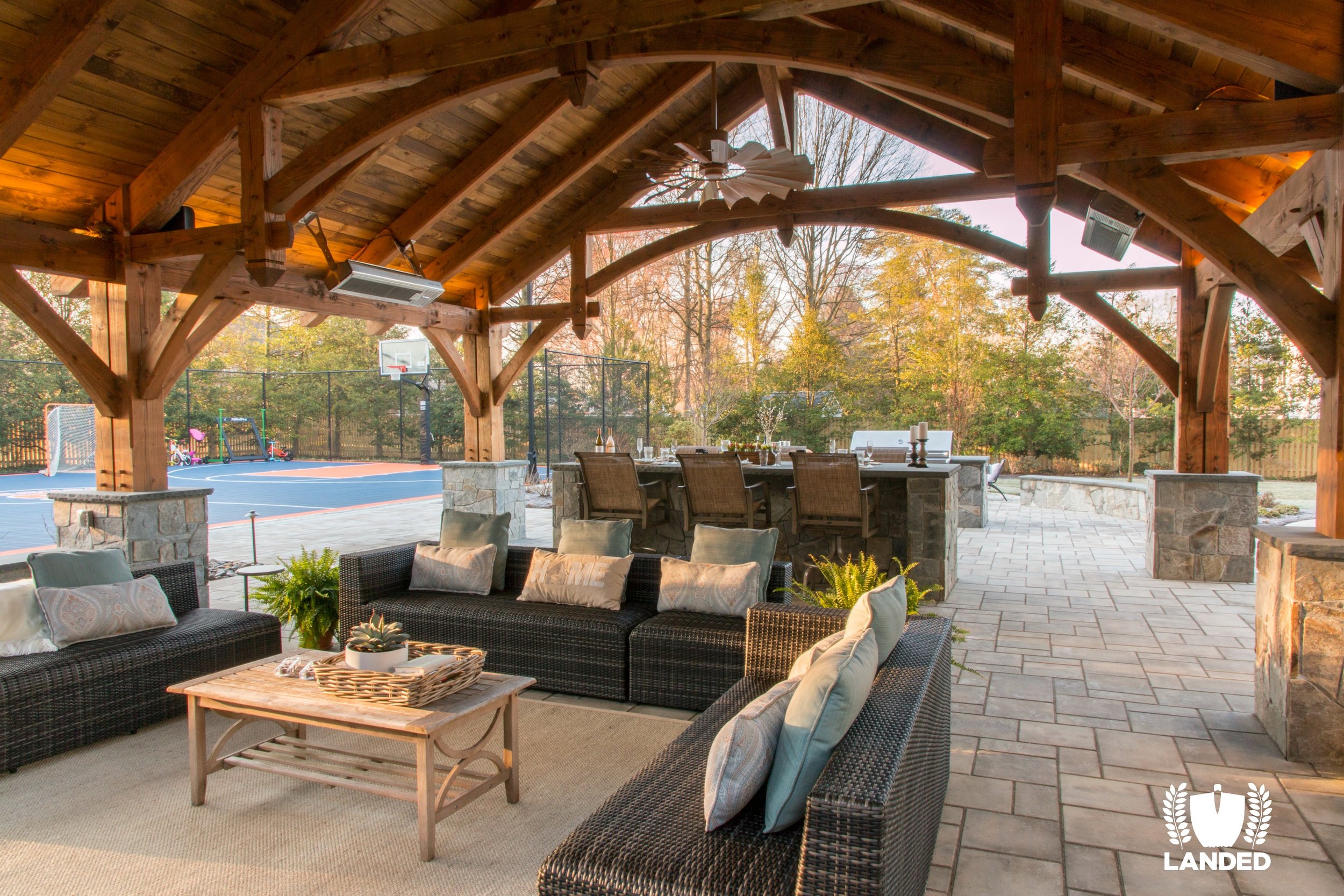  Timber frame outdoor patio, fireplace, dining bar, kitchen and fire pit. Techo Bloc pavers. 