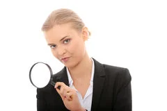 business-woman-looking-magnifying-glass-14568787.jpg