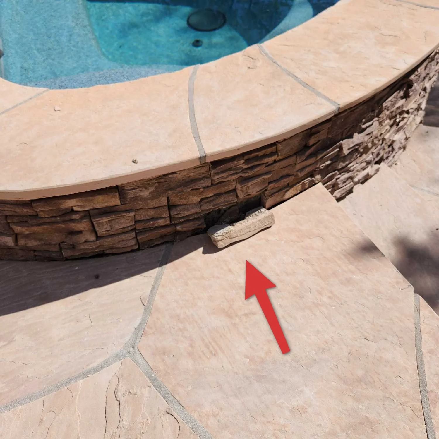 Loose piece of coping found during an Arizona pool inspection
