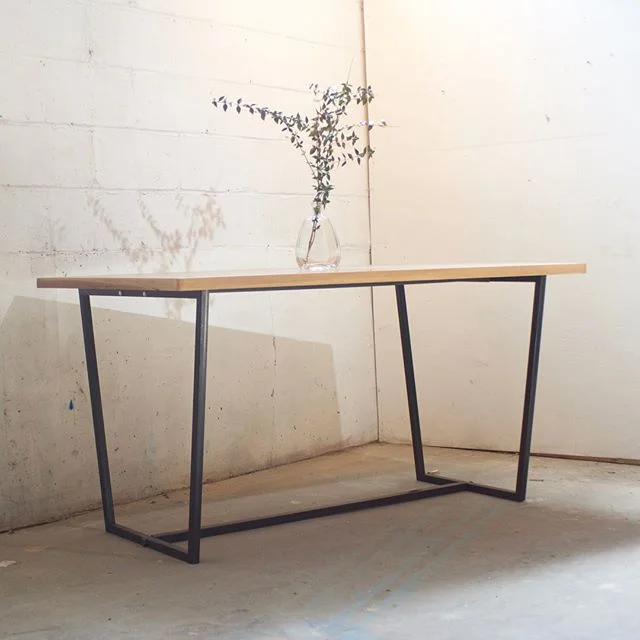 Reclaimed desk top.
Four piece bolt together steel base. 29&rdquo;x50&rdquo;x24&rdquo;
After we peeled all the stickers and sanded the old finish off I was really surprised by the beautiful walnut veneer hiding underneath. Hope you get a lot of work 