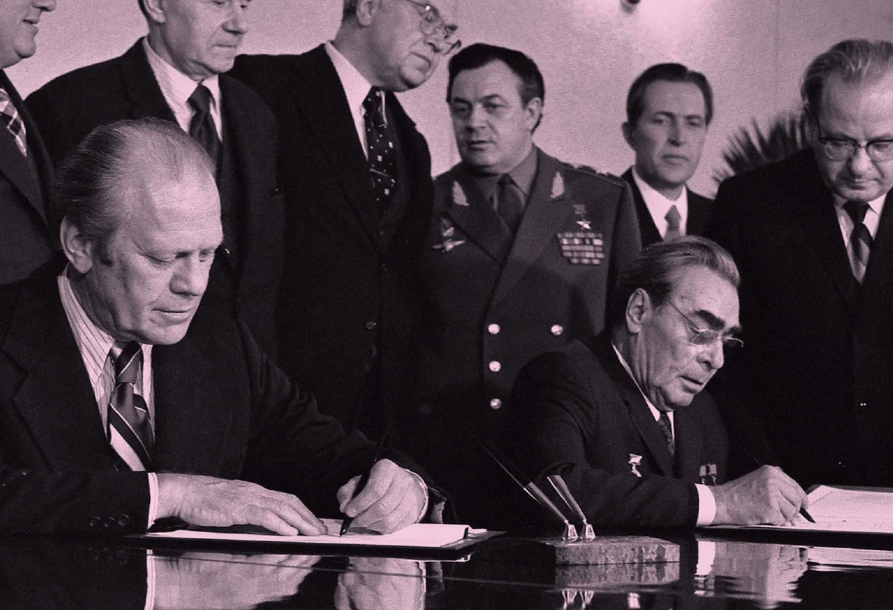 Following their bilateral talks, President Ford and Soviet General Secretary Leonid I. Brezhnev sign a joint communiqué on the limitation of strategic offensive arms in Vladivostok, USSR.  November 24, 1974.