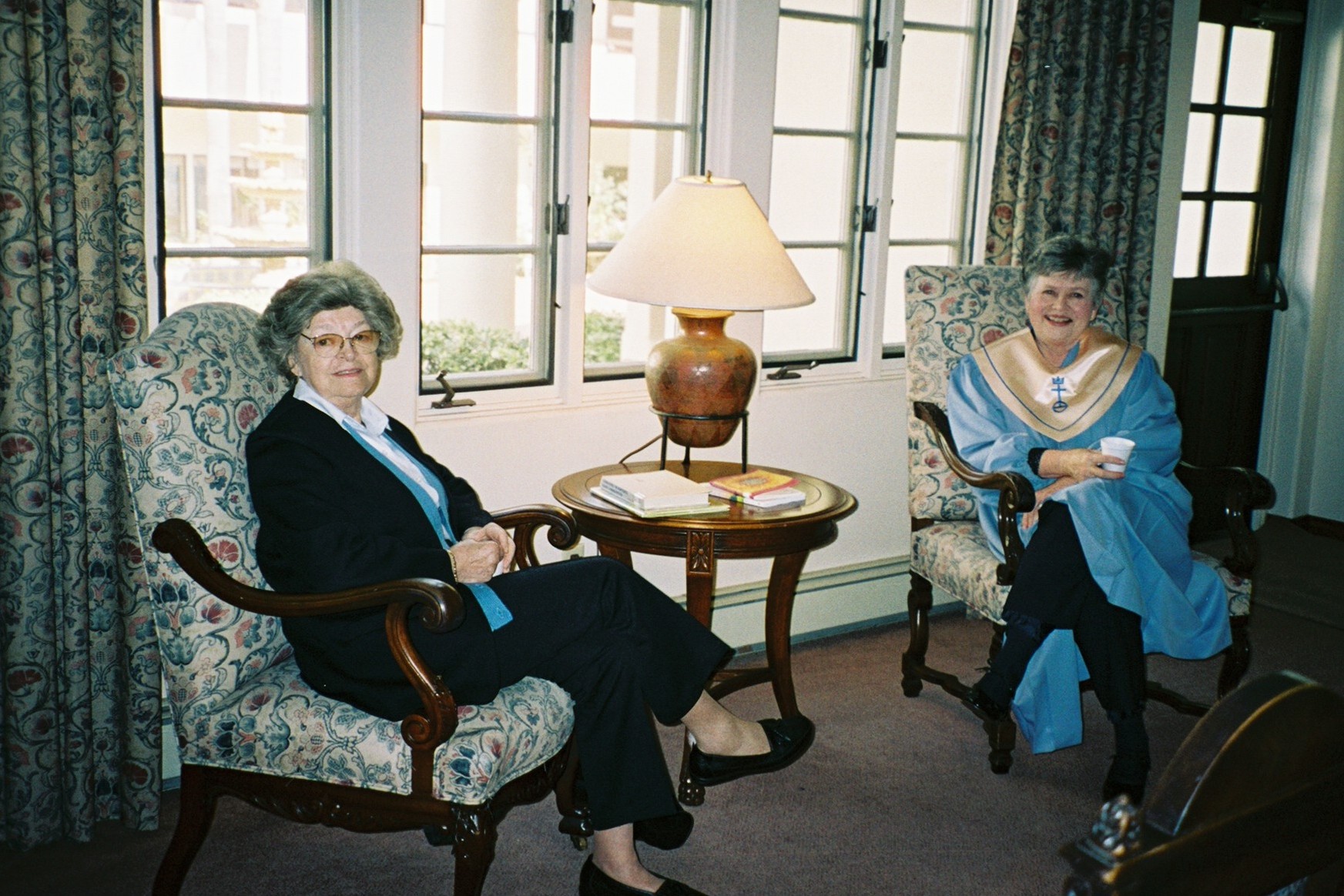 Jo McCaman, Church Wedding Coordinator, visiting with Becky Ogle before a wedding ceremony