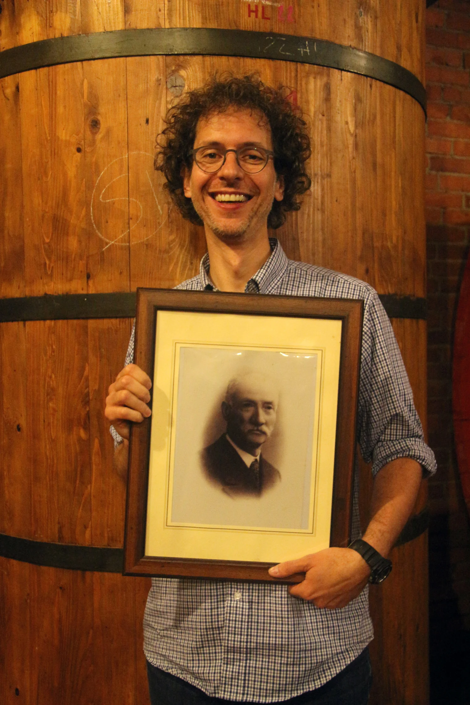 Augusto Cappellano with a portrait of his great-uncle Guiseppe
