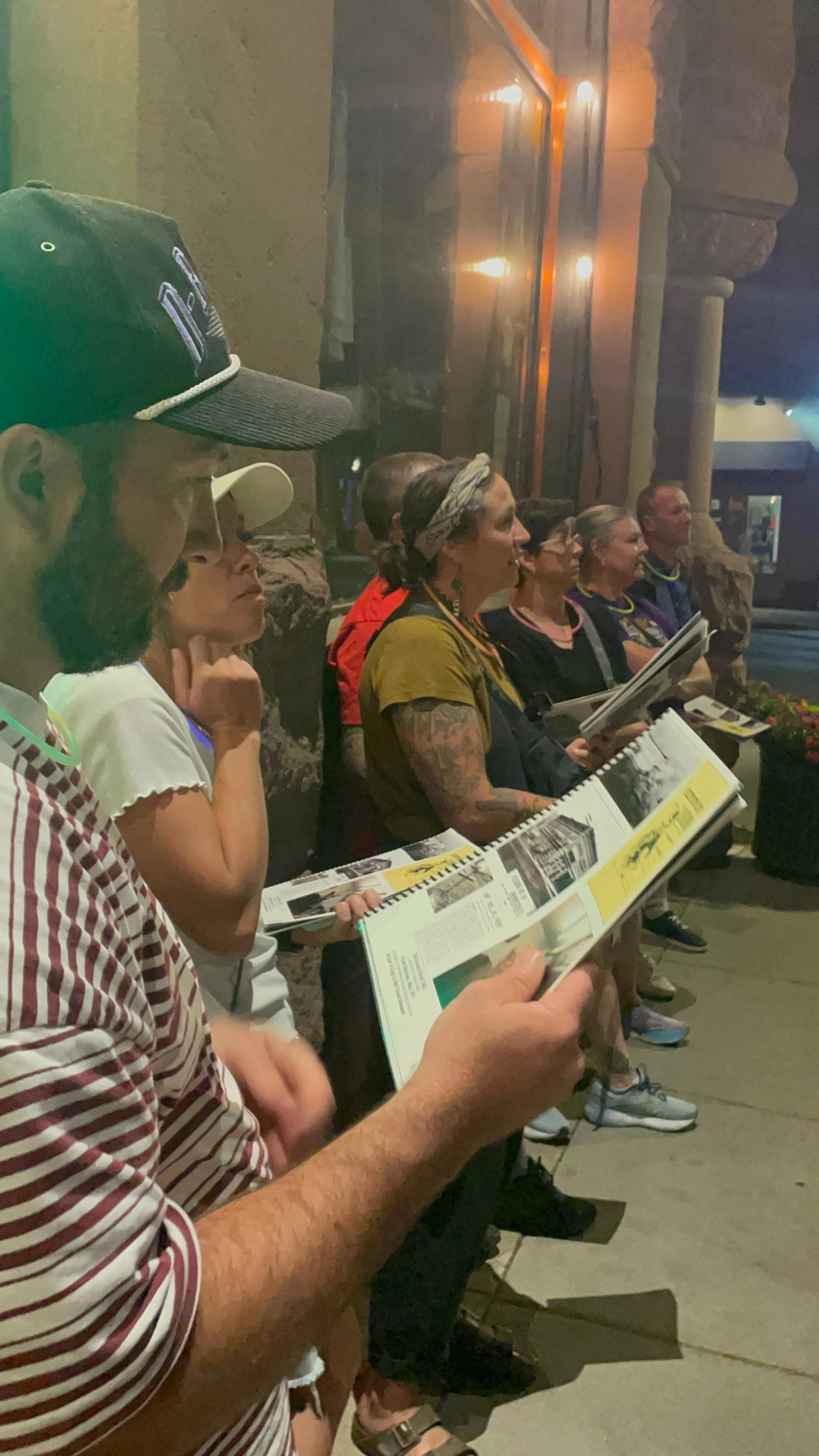 Ghost tour group against the wall