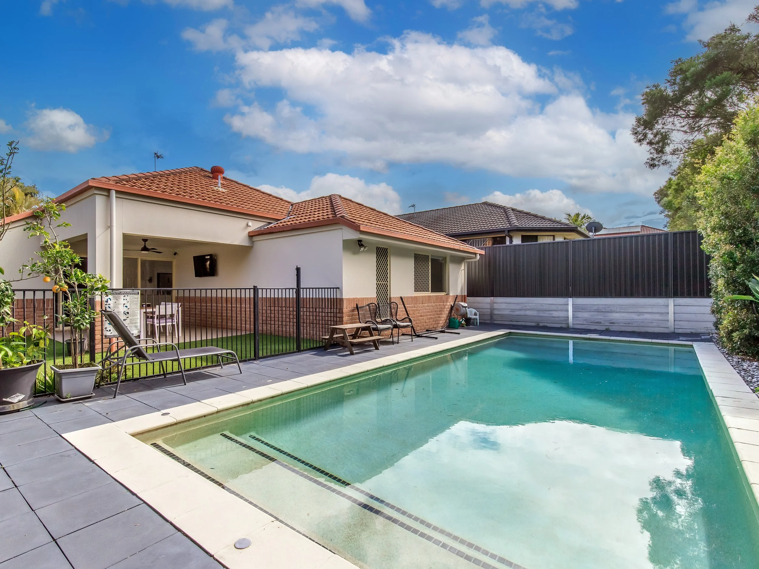 4_howea_way_robina_gold_coast_qld1 Pool and house.jpg
