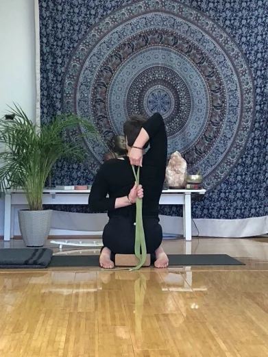 Gomukhasana Sitting in hero’s pose, knees together and feet outside your hips, place a block beneath your sitting bones. Stretch your right arm overhead, bend through the elbow bringing your hand down at the back of the head between the shoulder blades. Grab the elbow with your left arm. Stay here for a few breaths, and if available reach your left arm out to the side, palm facing back; then take your arm behind you. Slide the forearm up your back, monkey grip the fingers our use a strap if you can’t reach. Hold for 1 min then repeat on the other side.
