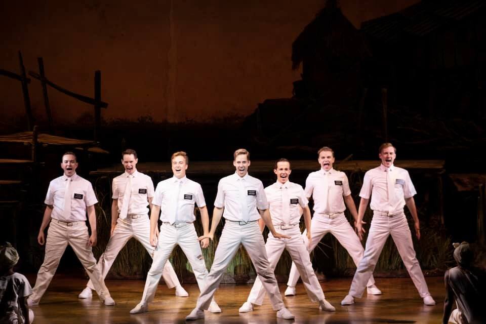   Andy Huntington Jones  (center) starring as Elder McKinley in THE BOOK OF MORMON 