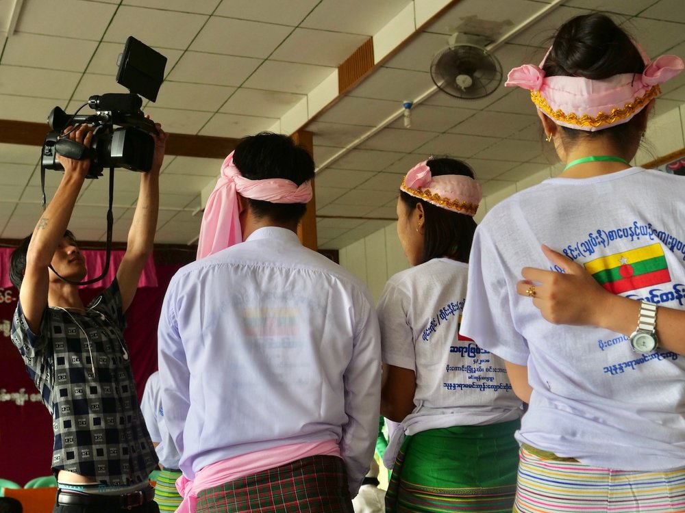  Newly inducted Shan-ni teachers wait to receive their diploma at a ceremony near Indawgyi.