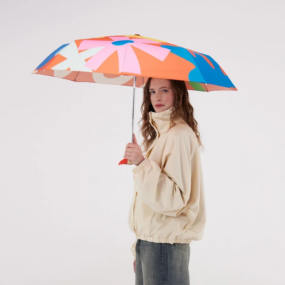 original-duckhead-salsa-duckhead-umbrella-being-held-open-by-model-square.jpg.webp