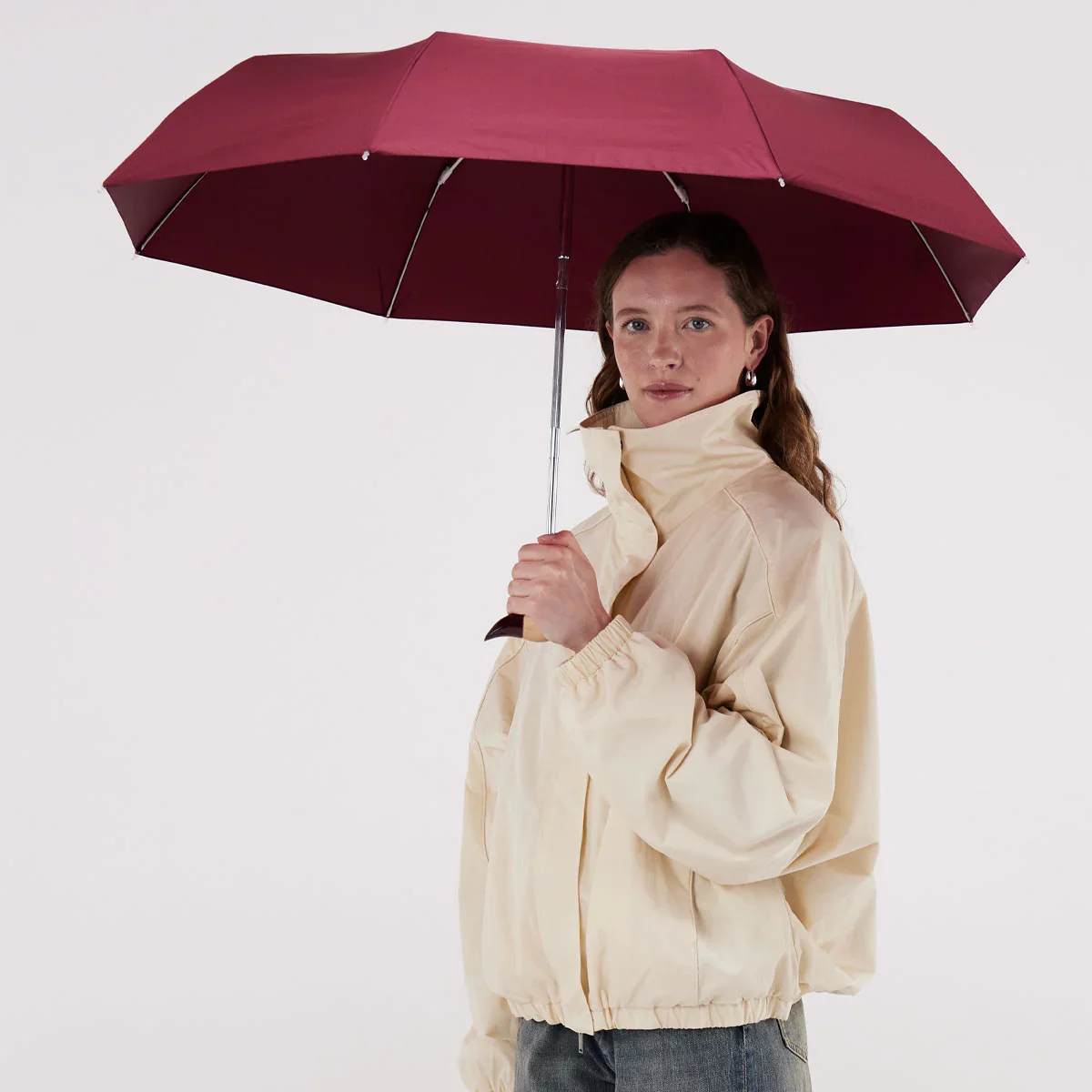 original-duckhead-cherry-duck-umbrella-being-held-open-by-model-square-1200-x-1200.jpg.webp