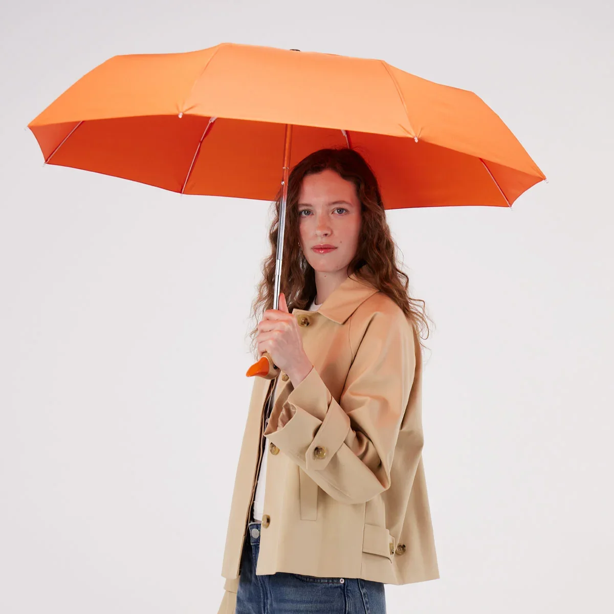 original-duckhead-papaya-duck-umbrella-being-held-open-by-model-square-1200-x-1200.jpg.webp