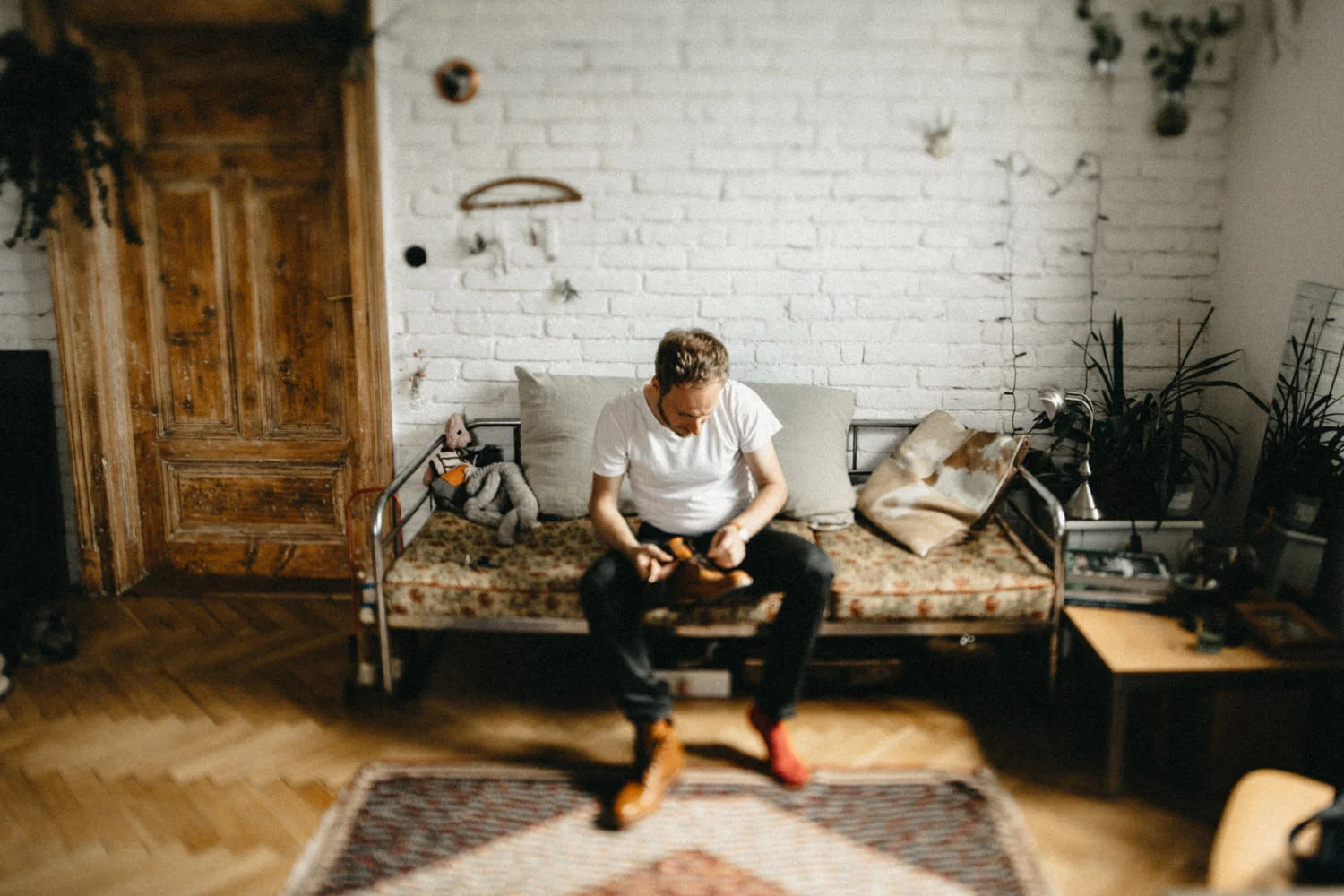 a groom getting ready in his hipster apartment