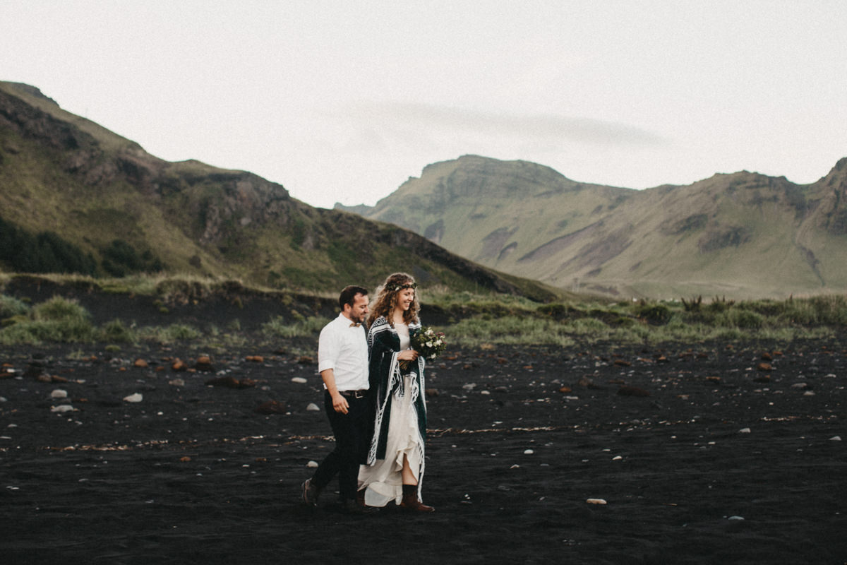 walking on a black sand beach